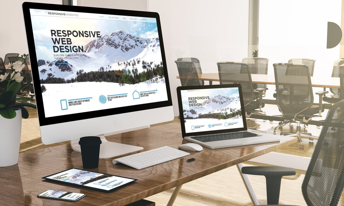 Modern office workspace with responsive web design displays